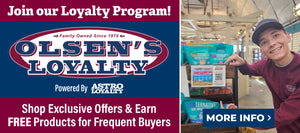 Promotional banner for Olsen's Loyalty Program powered by Astro Loyalty. Text reads 'Join our Loyalty Program! Shop Exclusive Offers & Earn FREE Products for Frequent Buyers.' Includes smiling employee pointing to a RawTernative pet food display with a QR code and sign for loyalty rewards. A 'More Info' button is also shown.